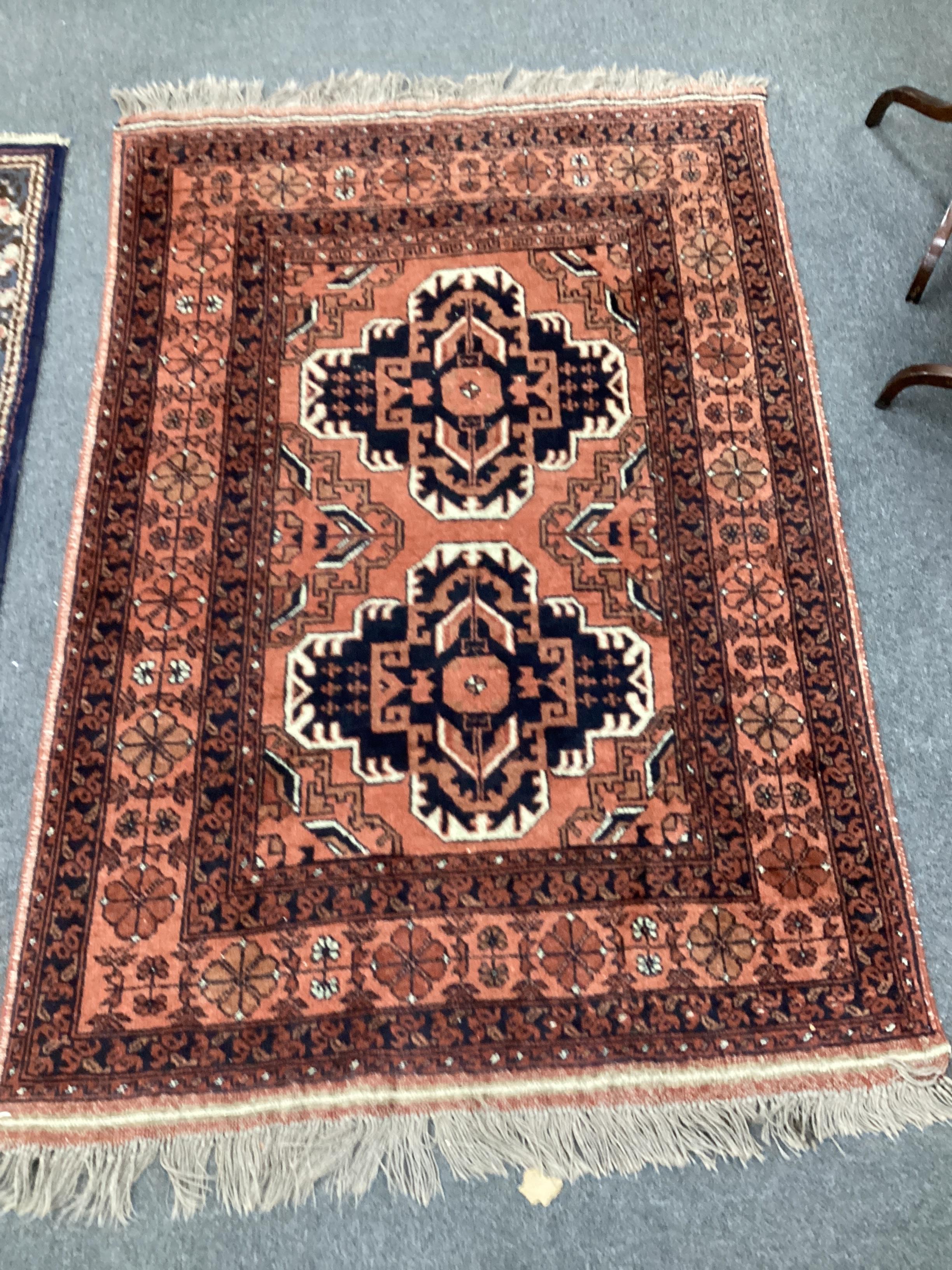 An Afghan red ground rug and a Bokhara gold ground rug, largest 180 x 121cm